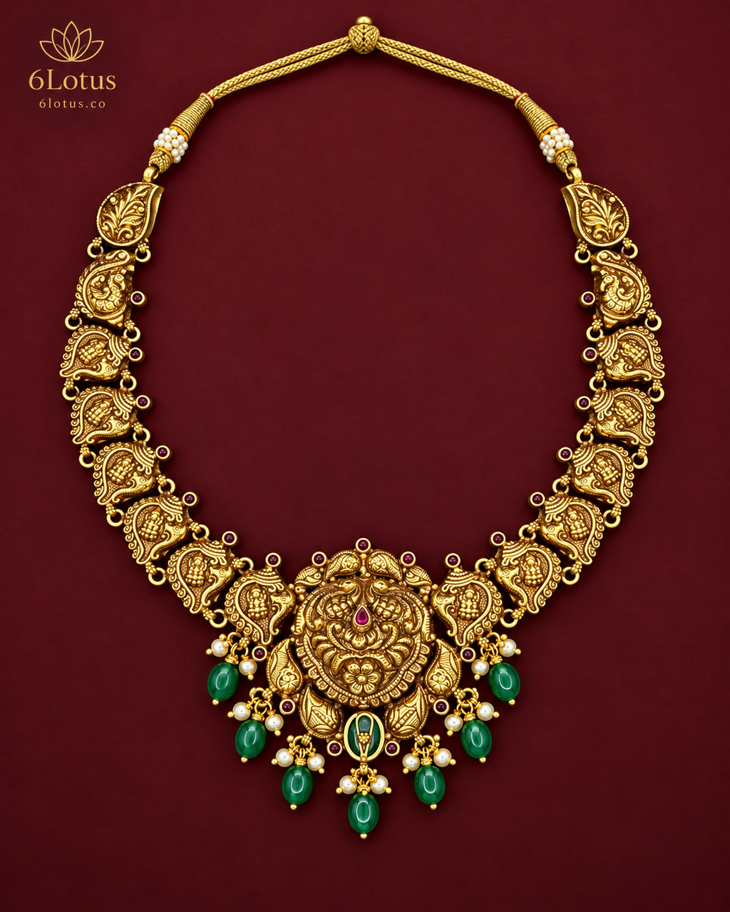 1020 temple necklace with seven green drops on maroon background
