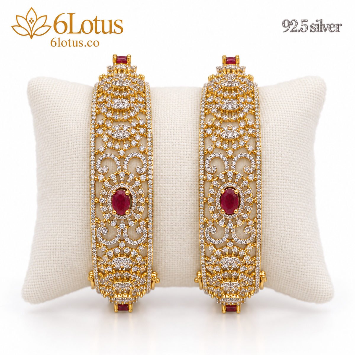1051 ruby scroll openwork bangles on ivory cushion